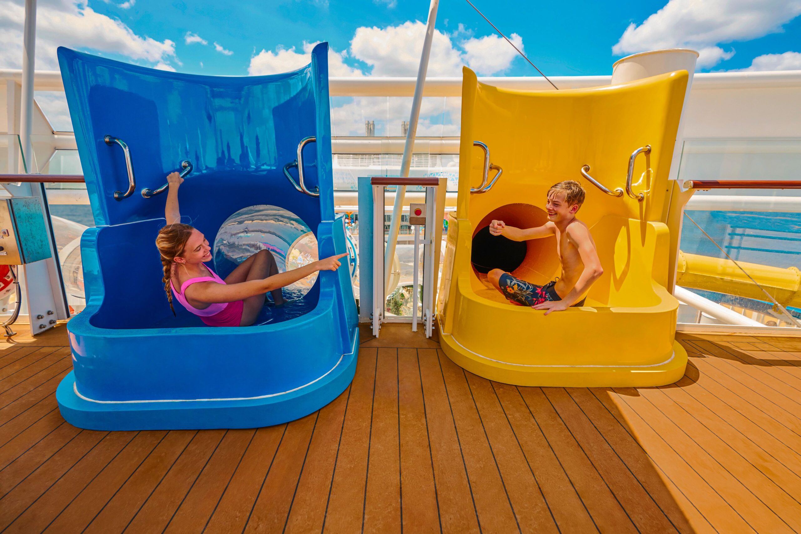WN, Wonder of the Seas, Brand shoot, young woman, teen, and teen boy getting ready to go down water slides, Perfect Storm, family fun, excitement,