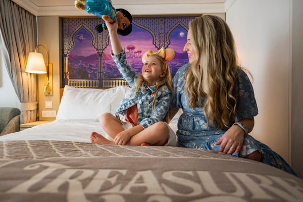 Family enjoying a ocean view verandah balcony on a discounted Disney Cruise Line ship.